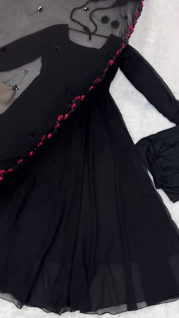 Black Anarkali Gown with Sheer Full Sleeves, Square Neckline, Matching Embroidered Dupatta with Pink Floral Sequin Detailing, Coordinated Accessories Including Hair Ties, Earrings, and Clutch – Perfect for Festive and Evening Wear