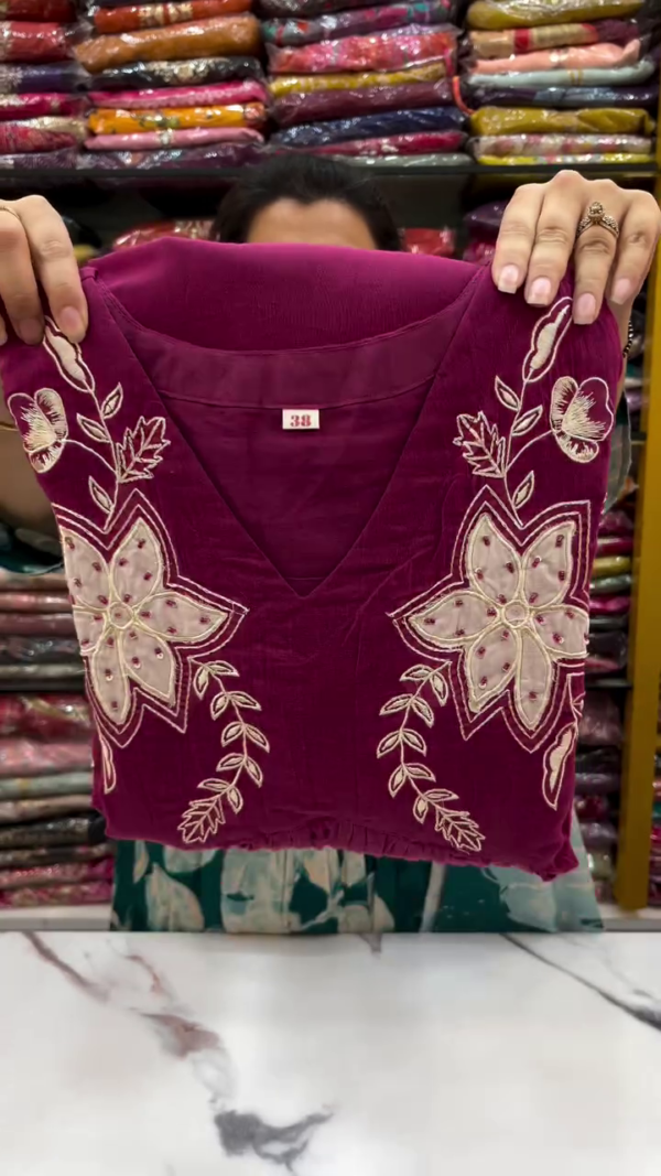 Magenta Flared Anarkali Kurta Set with Intricate White Floral Embroidery on Yoke, Border, and Sleeves Paired with Matching Solid Bottom – Perfect for Festive and Traditional Occasions