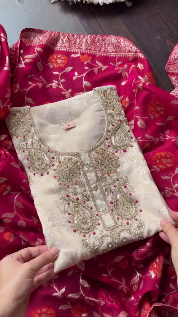 Cream Premium Tissue Silk Straight Kurta Set Featuring Intricate Zari and Sequin Embroidery on Yoke, Subtle Self-Weave Detailing, Paired with Coordinated Bottoms and Contrasting Rich Pink Banarasi Floral Dupatta – Ideal for Festive and Ethnic Celebrations