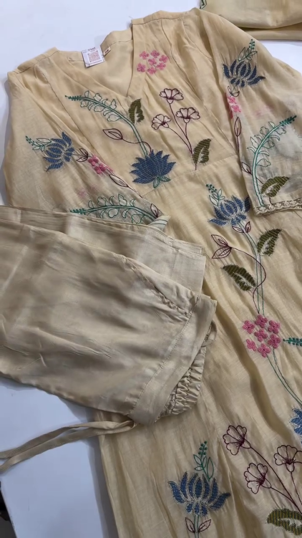 Dual-Tone Ethnic Suit Set Featuring Soft Blue and Beige Color Options, Intricately Embroidered with Multicolored Floral and Leaf Motifs on Silk-Look Fabric, Styled with Scalloped Neckline and Coordinated Sleeves and Bottoms – A Graceful Ensemble for Festive and Semi-Formal Occasions - Image 4
