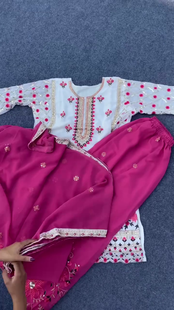 White and Rani Pink Heavy Embroidered Georgette Suit Set for Women Featuring Mirror and Thread Work on Neck and Sleeves, Floral Detailing, and Matching Embroidered Bottom and Dupatta – Ideal for Festive and Wedding Occasions