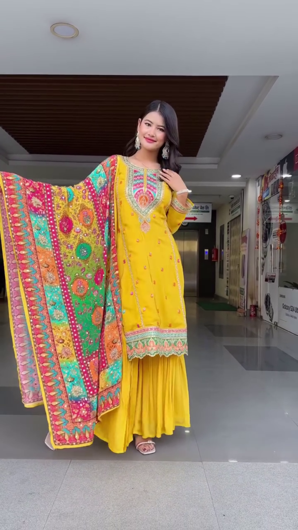 Vibrant Yellow Ethnic Sharara Suit with Multi-Color Heavy Embroidered Dupatta, Ornate Neckline Design, Mirror Accents, and Coordinated Sharara Bottom – Ideal for Festive Occasions, Haldi Ceremonies, and Traditional Gatherings
