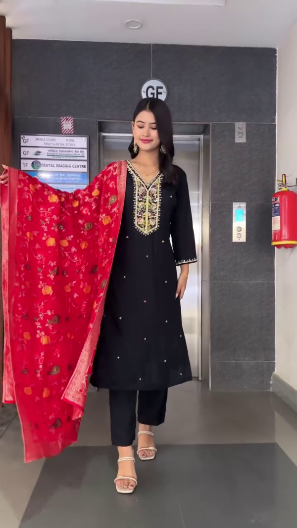 Black Straight-Cut Kurta Set with Intricate Multicolor Thread Embroidery and Mirror Work on Neckline, Paired with Matching Bottoms and a Rich Red Velvet Floral Printed Dupatta – Perfect for Festive Celebrations and Evening Occasions - Image 2