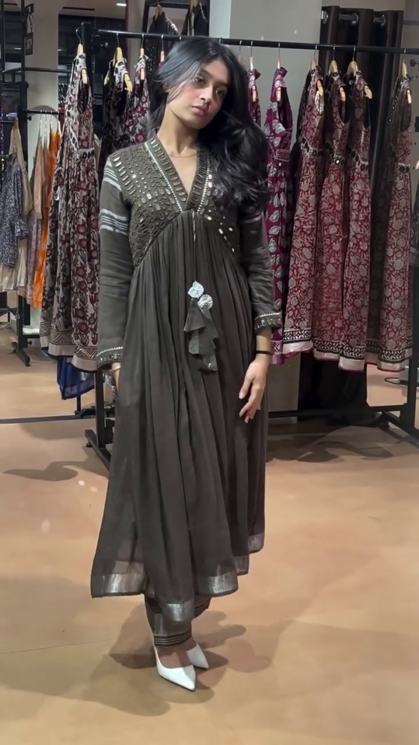 Stunning Black Flared Anarkali Suit Featuring Intricate Mirror and Thread Embellishments on Yoke and Sleeves, Paired with Matching Pants and Elegant Tassel Detailing – Perfect for Festive and Evening Wear - Image 2