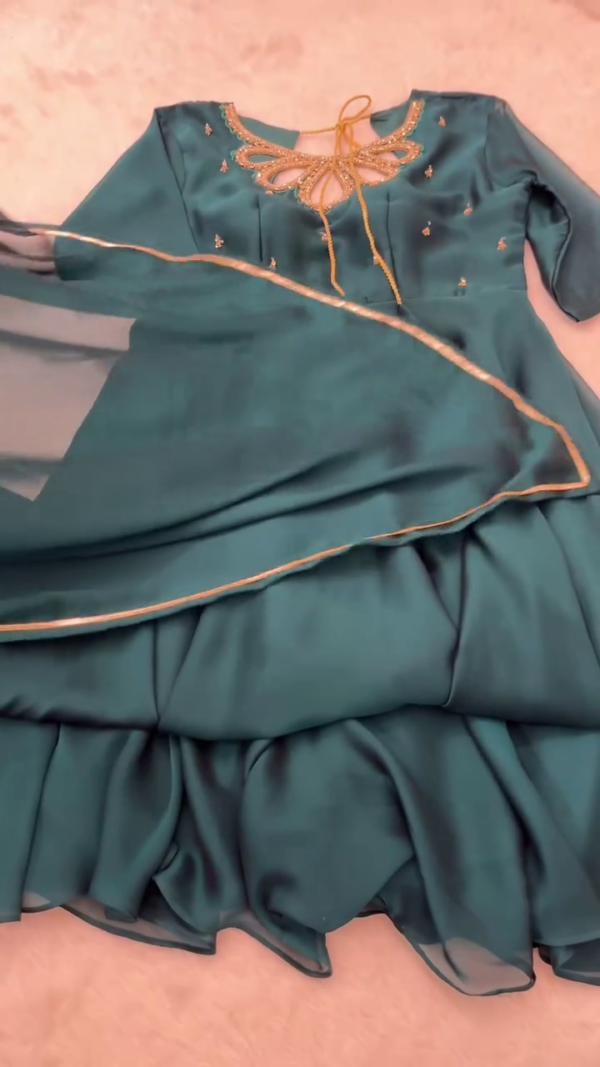 Teal Green Georgette Anarkali Style Suit with Intricate Neck Embroidery, Tie-Up Detailing, and Flowy Layered Flair Paired with Matching Sheer Dupatta for Festive and Special Occasions - Image 2