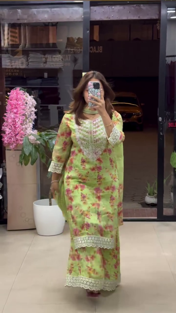 Floral Printed Straight Suit Set in Vibrant Green and Pink Shades, Featuring Intricate Lace Detailing on Neckline, Sleeves, and Hem – Paired with Matching Palazzo Pants and Coordinated Dupatta for a Refreshing Festive and Summer Look