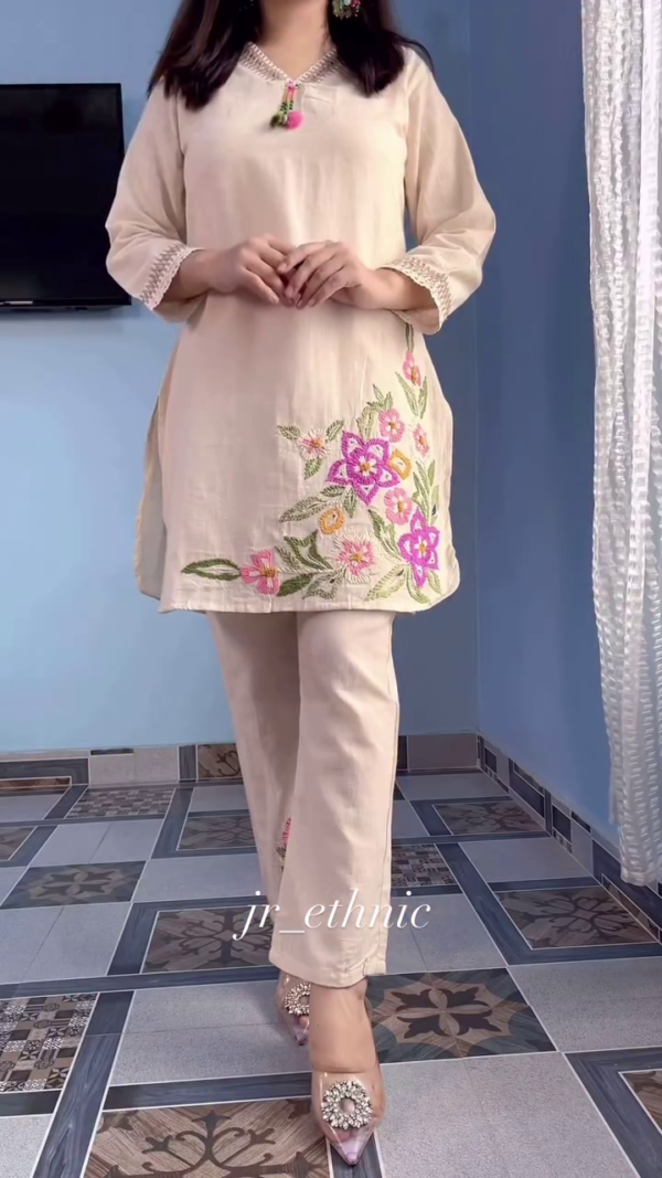Beige Cotton Kurta Pant Set with Intricate Multicolor Floral Embroidery, Subtle Lace Detailing on Sleeves, and Stylish Tassel Neckline – Perfect for Festive and Casual Ethnic Wear