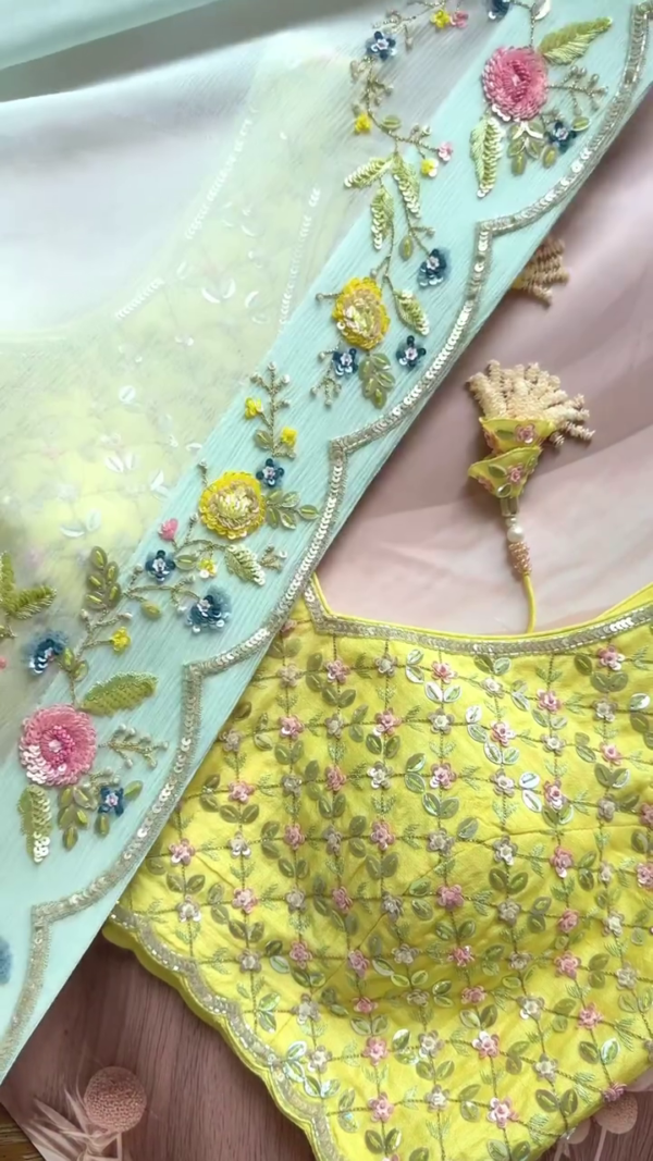 Pastel Green Soft Organza Saree with Multicolor Floral Sequin Embroidery Paired with Vibrant Yellow Thread Work Blouse for Elegant Festive and Daytime Celebrations