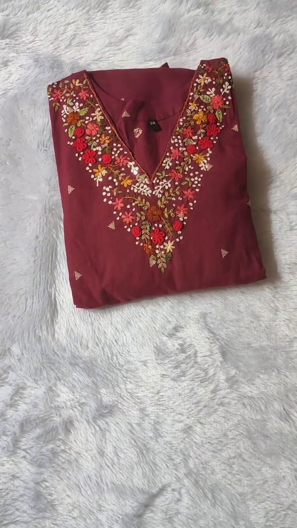 Maroon Cotton Kurta Set with Colorful Floral Embroidery on Neckline, Subtle Golden Motifs on Fabric, and Striped Tassel Dupatta with Pant – Perfect for Festive and Casual Wear