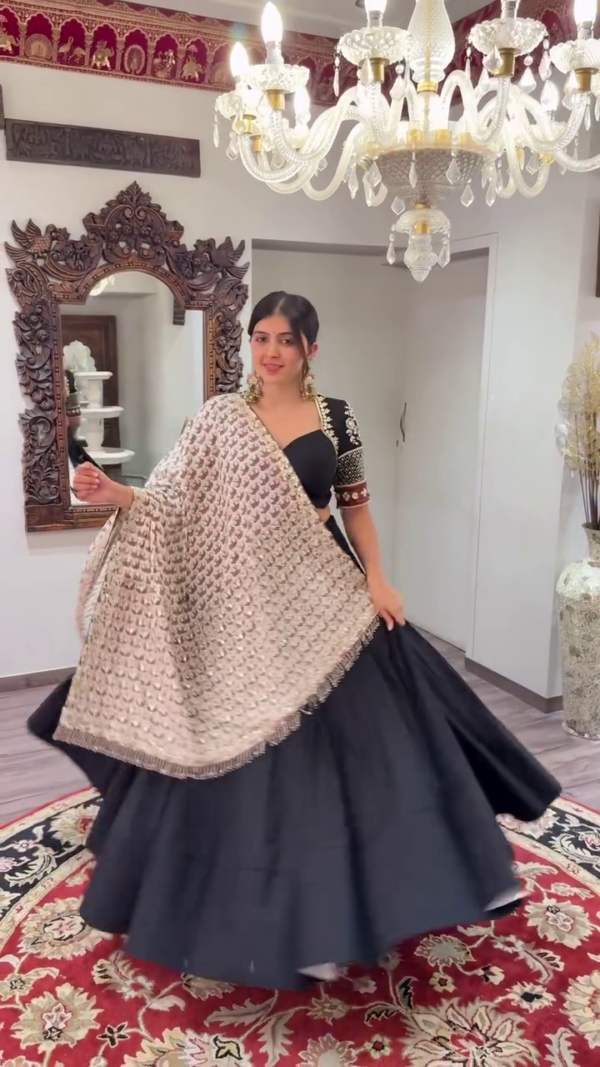 Stunning Black Lehenga Choli Set Featuring Embroidered Elbow-Sleeve Blouse Paired with Flowing Solid Skirt and Heavy Sequin-Embellished Dupatta – Ideal for Weddings And Garba Nights