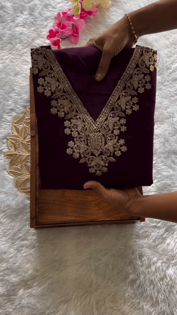 Graceful Wine Purple Straight-Cut Suit Set with Intricate Golden Embroidery on Neckline and Sleeves, Paired with Matching Bottom and Colorful Floral Printed Organza Dupatta – Elegant Ethnic Wear for Women