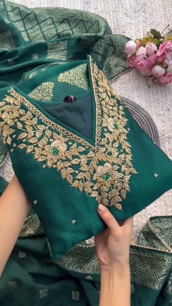 Deep green suit with elegant golden embroidery and geometric motifs — perfect for a graceful festive or formal look.