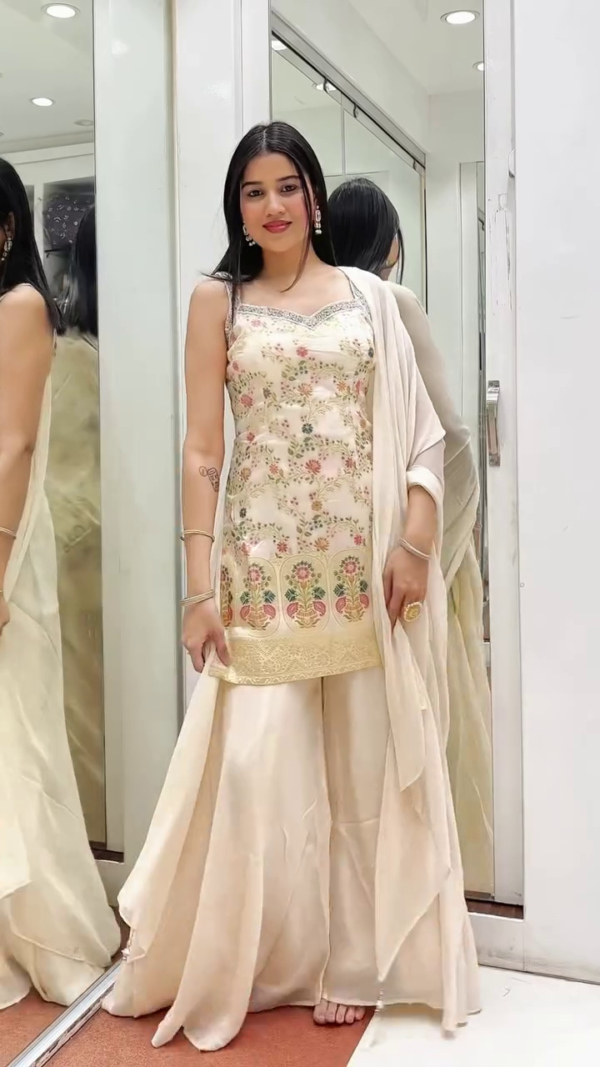 Ivory Embroidered Sharara Set with Spaghetti Strap Kurti – Floral Thread Work Top Paired with Layered Flowy Sharara and Matching Dupatta – Perfect for Festive & Daytime Events