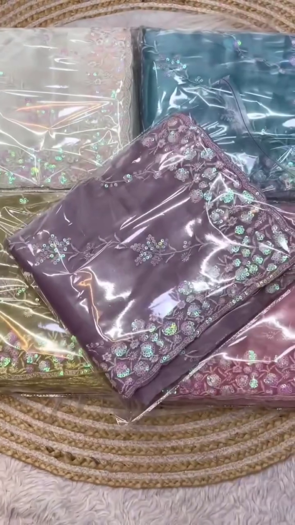 Lavender Organza Saree with Intricate Sequin & Thread Embroidery – Soft Sheer Fabric with Floral Border Detailing – Lightweight Festive Drape for Elegant Occasions