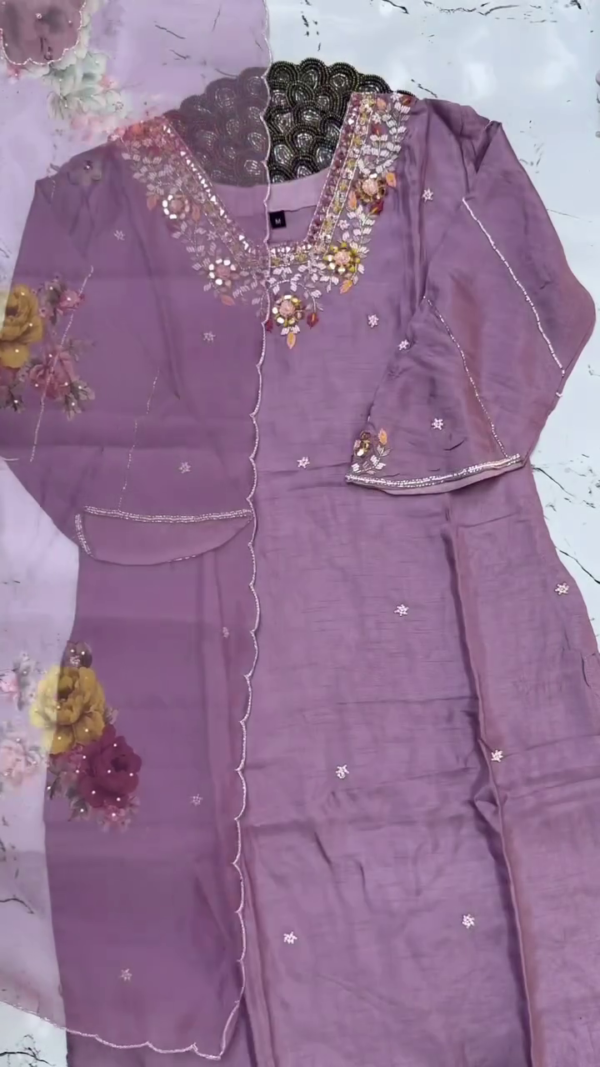 Elegant lavender suit with delicate sequin and thread embroidery around the neckline and sleeves. Paired with a floral-printed dupatta featuring scalloped edges for a graceful finish. - Image 2
