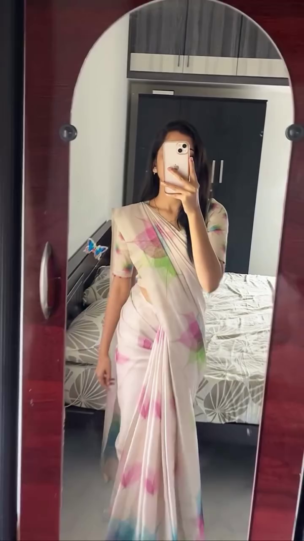 Soft Cream Floral Printed Organza Saree with Subtle Hues of Pink, Green, and Blue – A Breezy, Elegant Pick for Minimal Yet Graceful Daytime Looks.