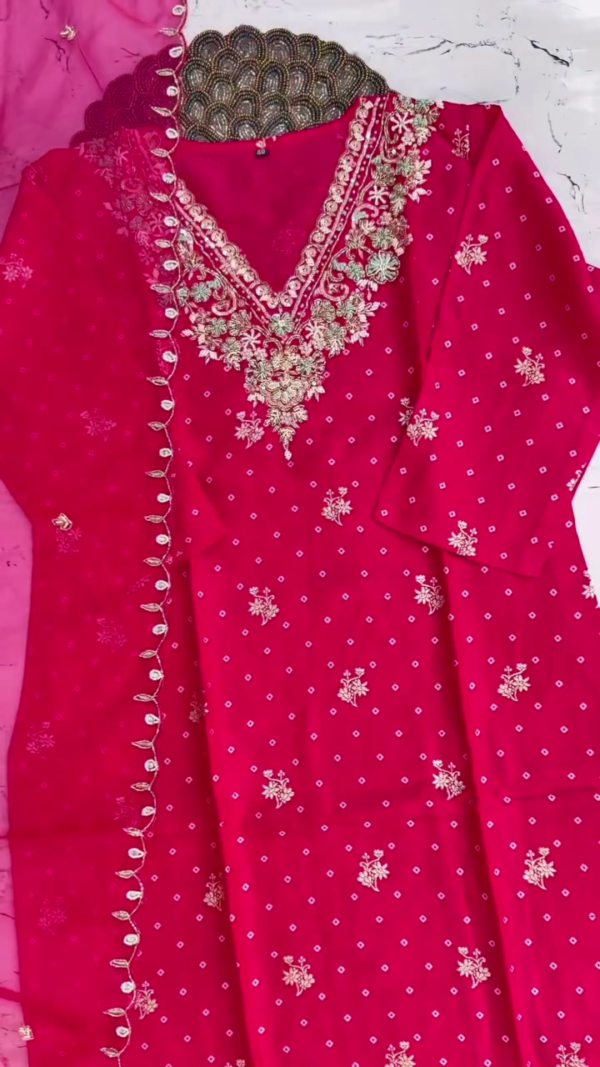 Bright pink suit with intricate silver-golden embroidery and mirror lace dupatta — a striking and festive choice. - Image 2