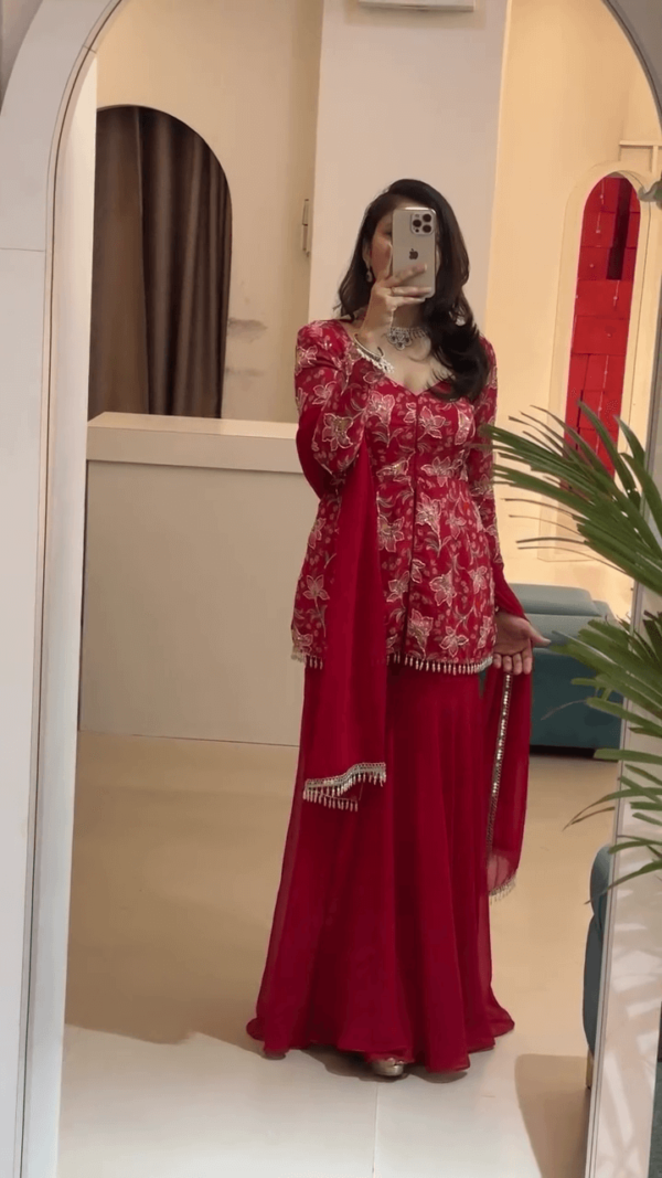 Elegant Red Embroidered Anarkali Dress with Floral Detailing, Paired with a Matching Dupatta and Tassel Accents