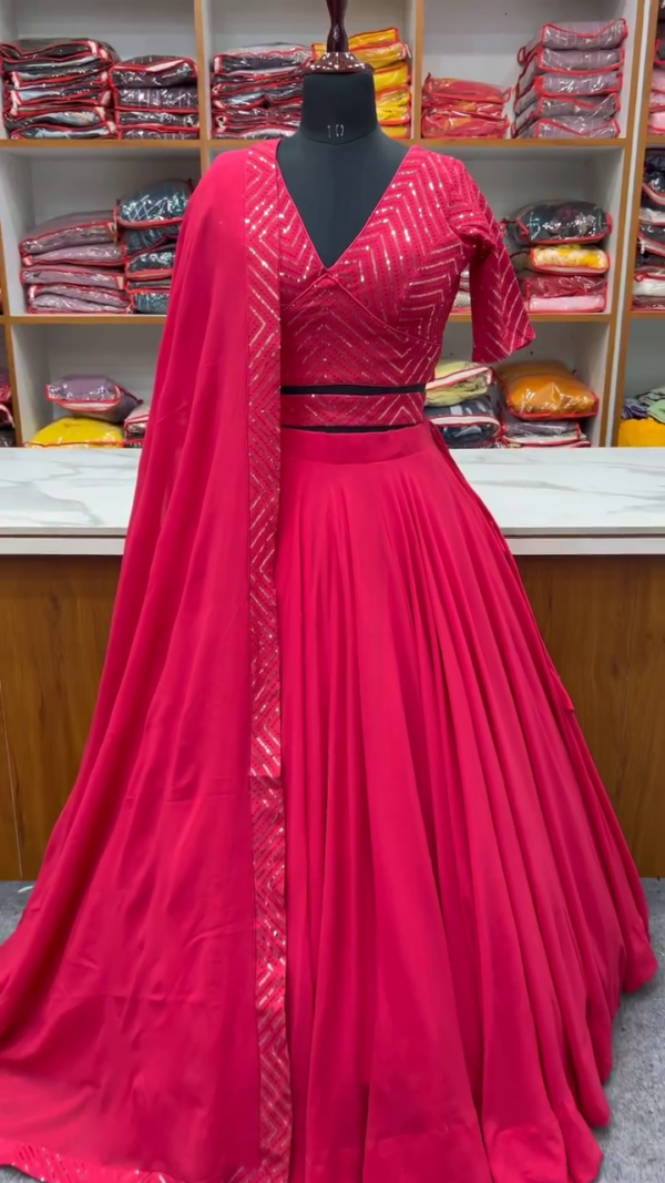 Hot Pink Georgette Lehenga Set with Sequin-Embroidered Blouse – Flowy Pleated Skirt & Matching Dupatta with Shimmer Detailing – Bold & Beautiful Festive Wear for Sangeet & Wedding Nights.